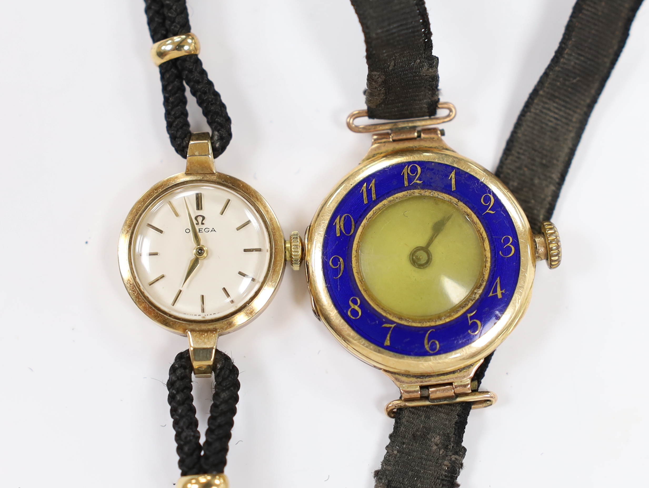 A lady's early 1960's 9ct gold Omega manual wind wrist watch, on a twin strand fabric strap, together with one other 9ct gold and enamel manual wind wrist watch.